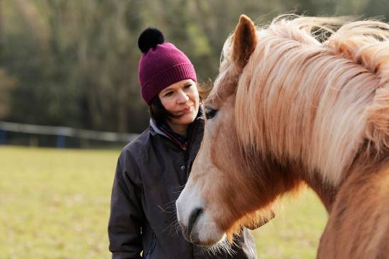 woman speaking with horse